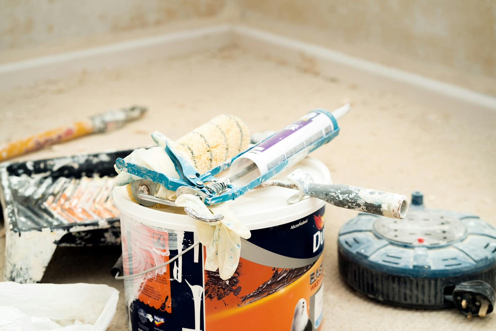 Paint buckets and rollers prepared for decorating work